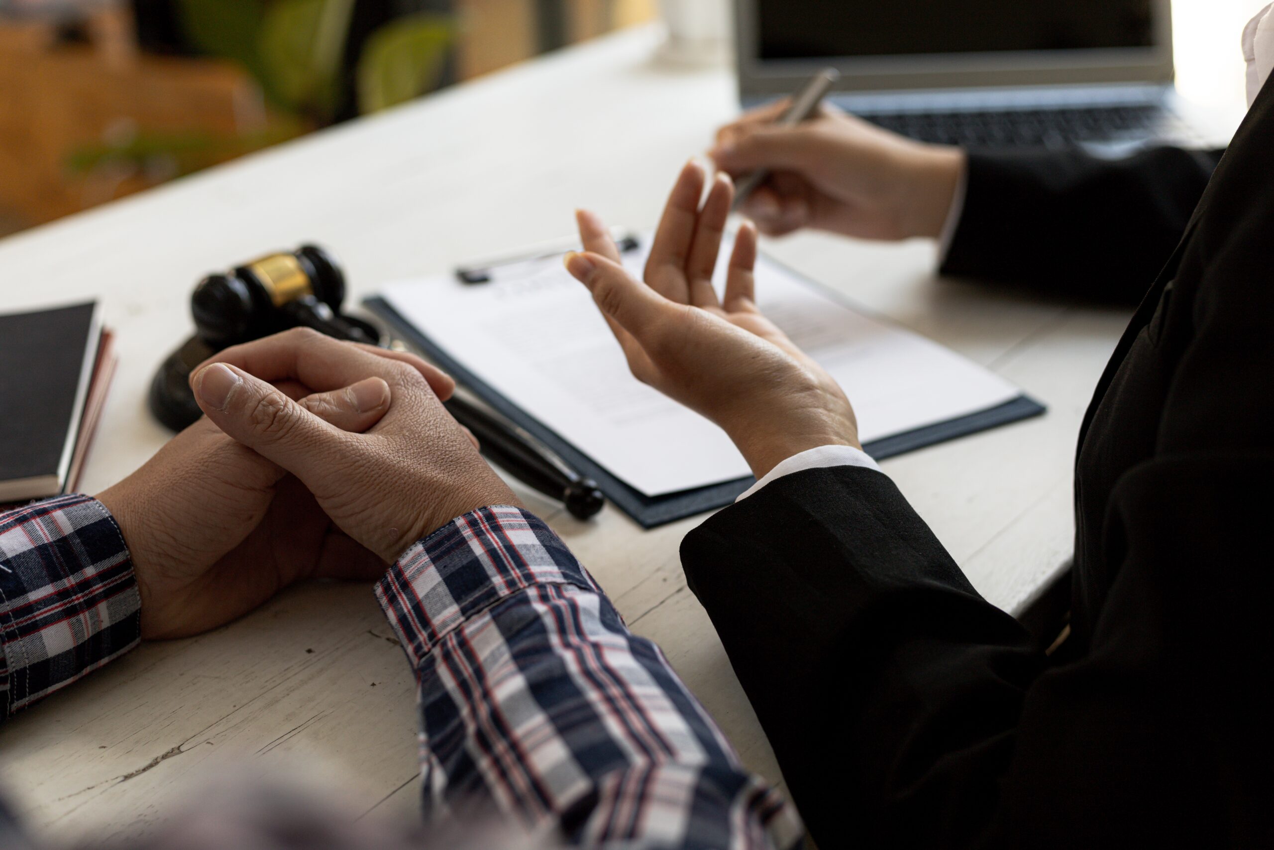 Lansing Michigan brain injury lawyer consulting with TBI client about personal injury case