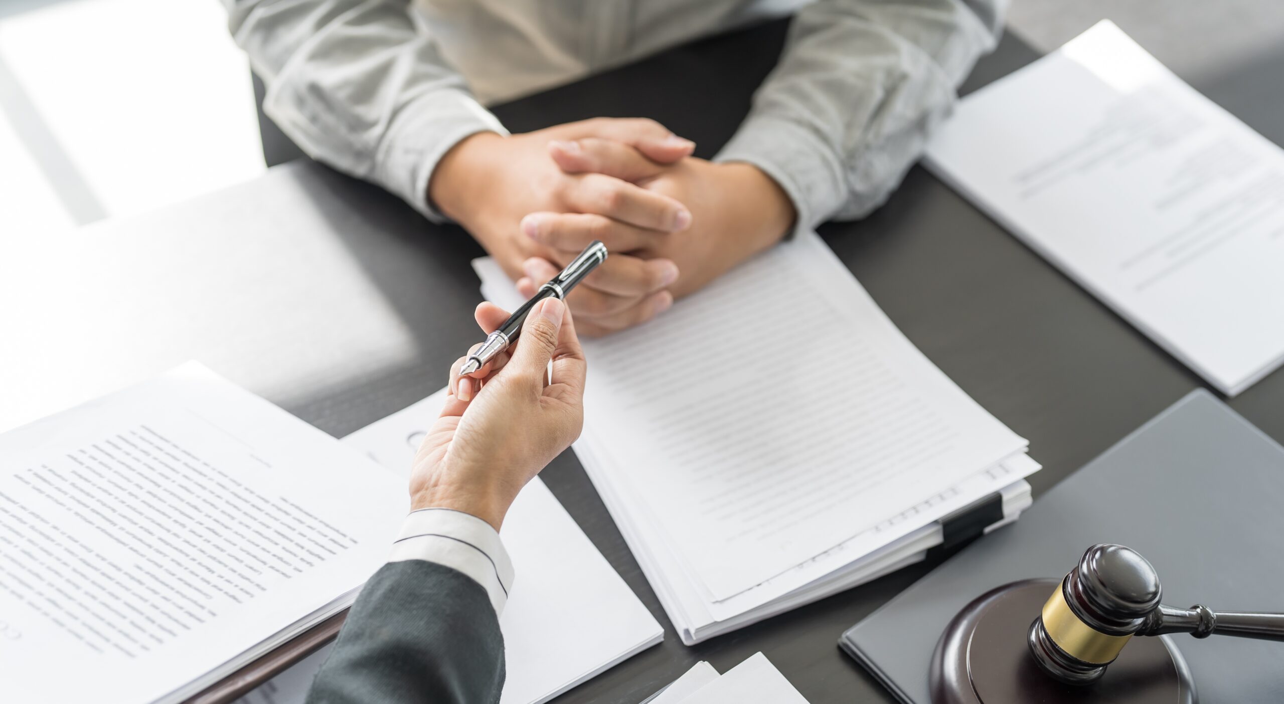 Federal Gun Crimes Lawyer discussing case with clients