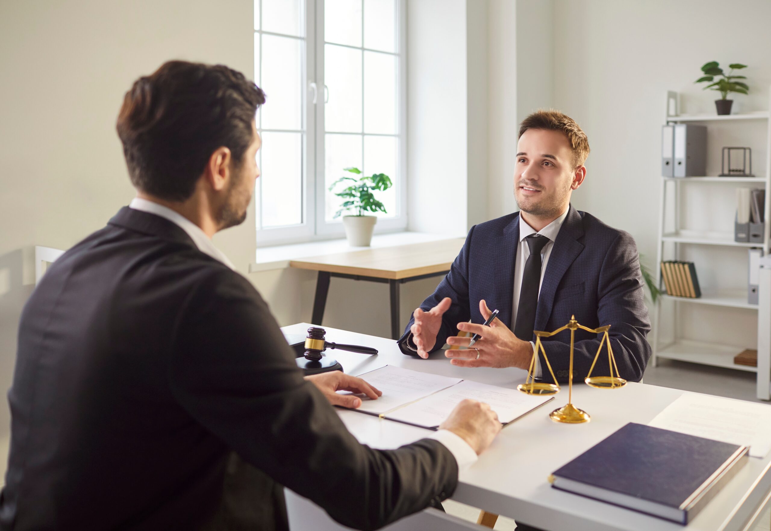 Lansing drunk driving attorney meeting with client for confidential DUI case consultation