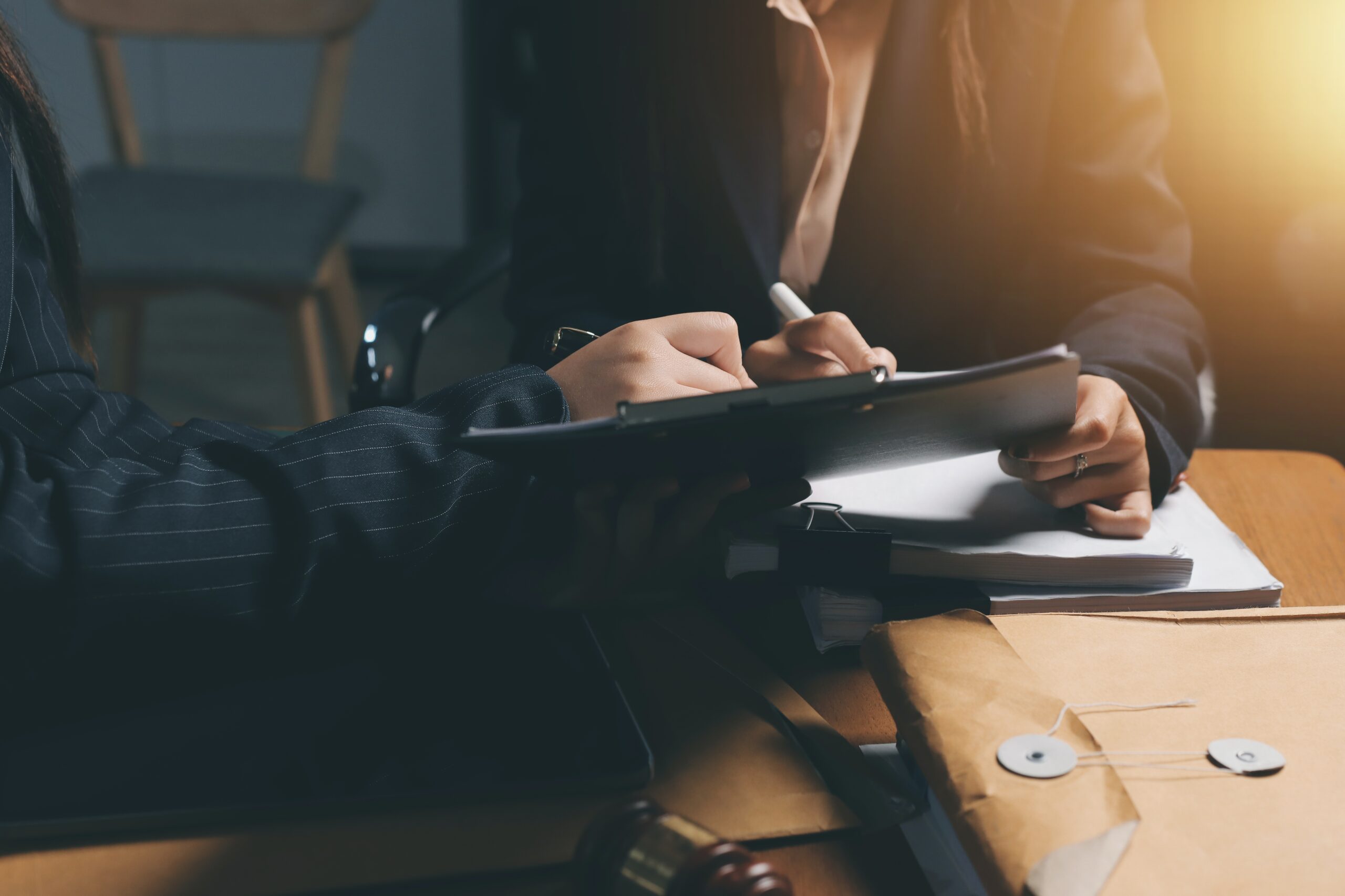 Lansing robbery attorney team discussing defense strategy