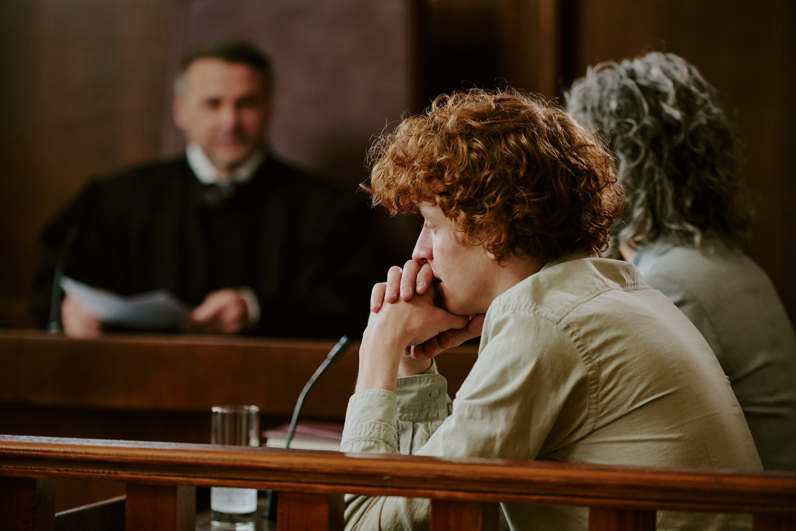 Courtroom scene depicting legal representation for minor defendants