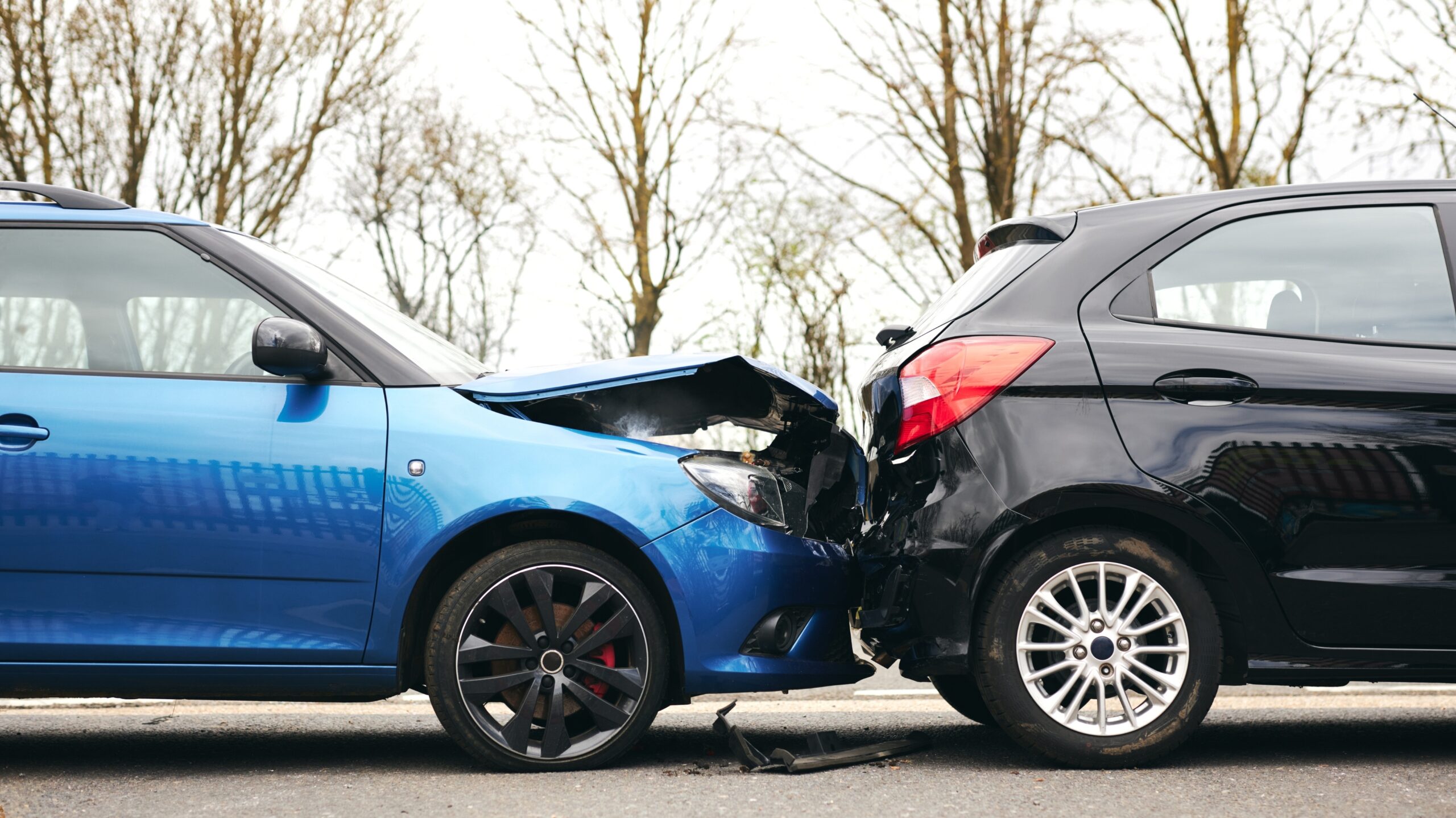 Serious car crash damage on Lansing Michigan road requiring legal representation