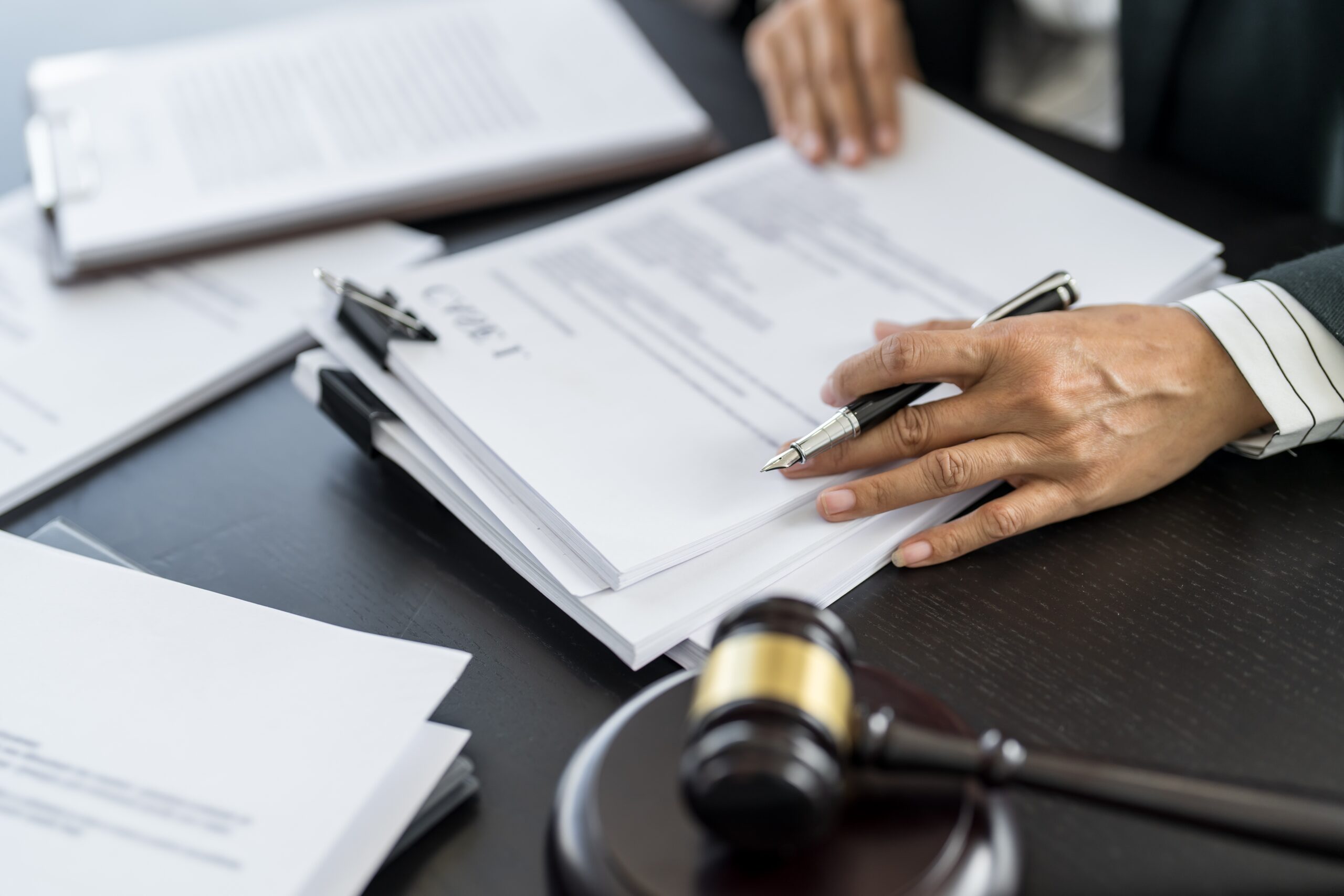 Experienced Lansing motorcycle accident attorney reviewing crash scene evidence